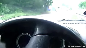 A fiery redhead performs an blowjob,car